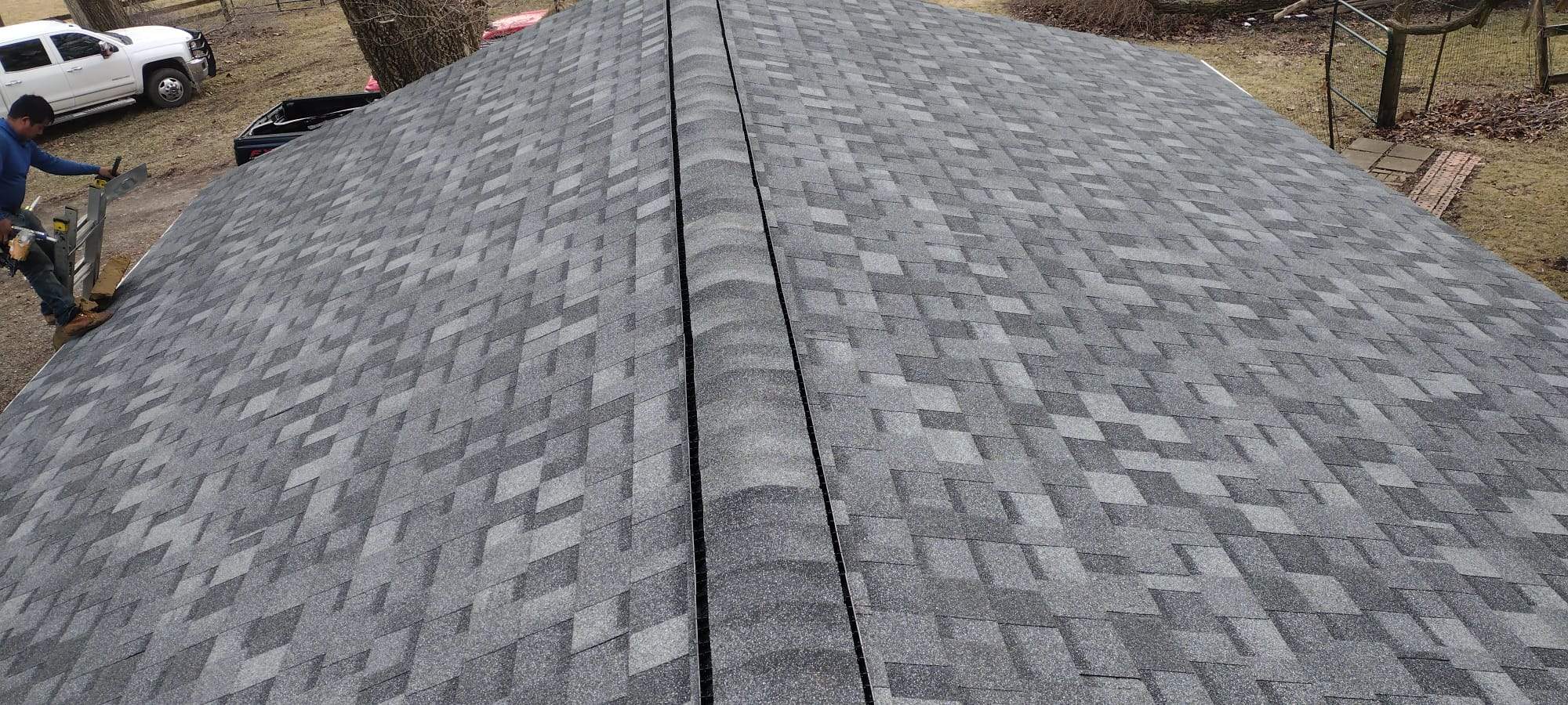Architectural asphalt shingle installation showing dimensional profile