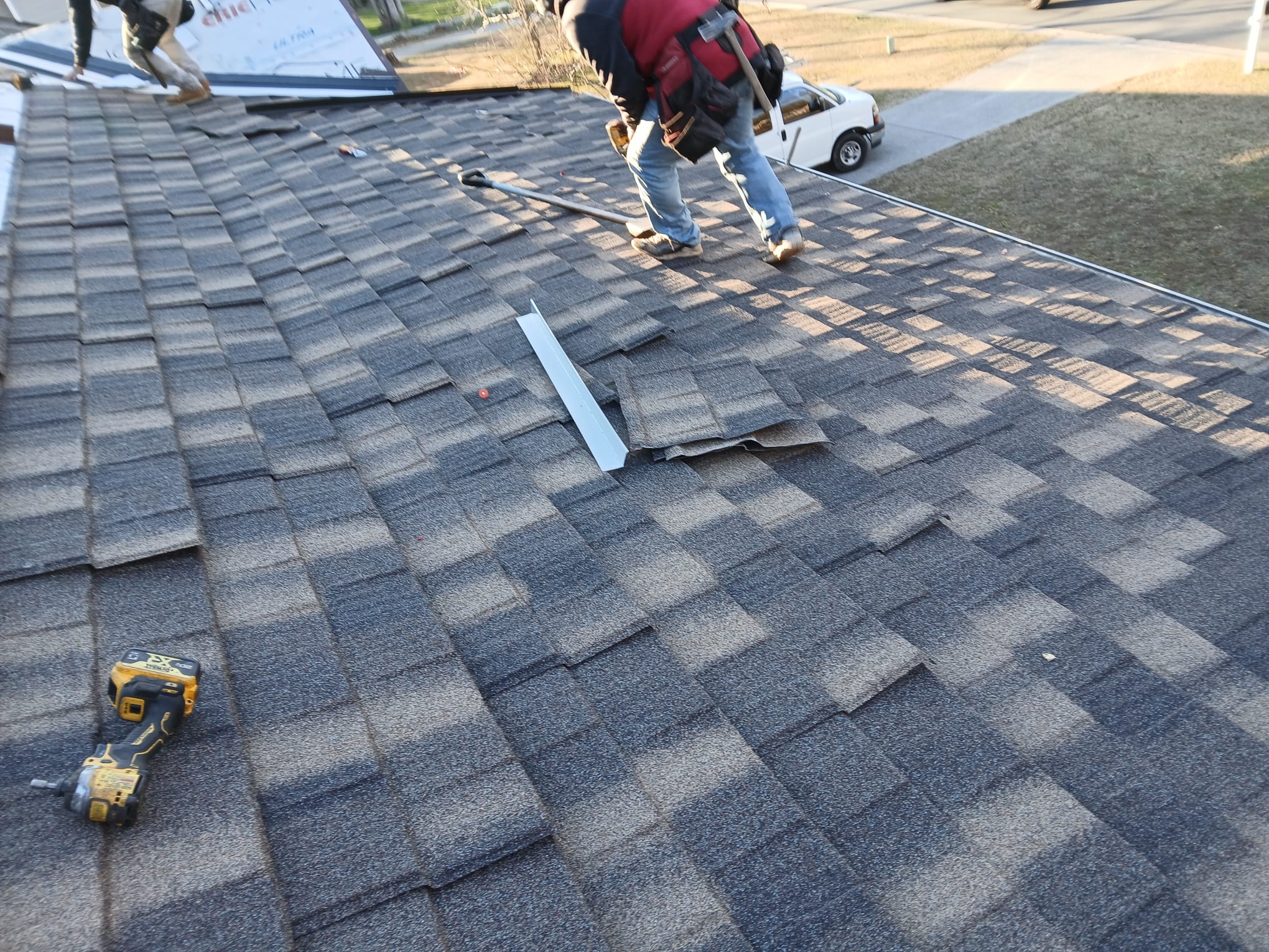 Asphalt shingle repair and replacement on residential rooftop