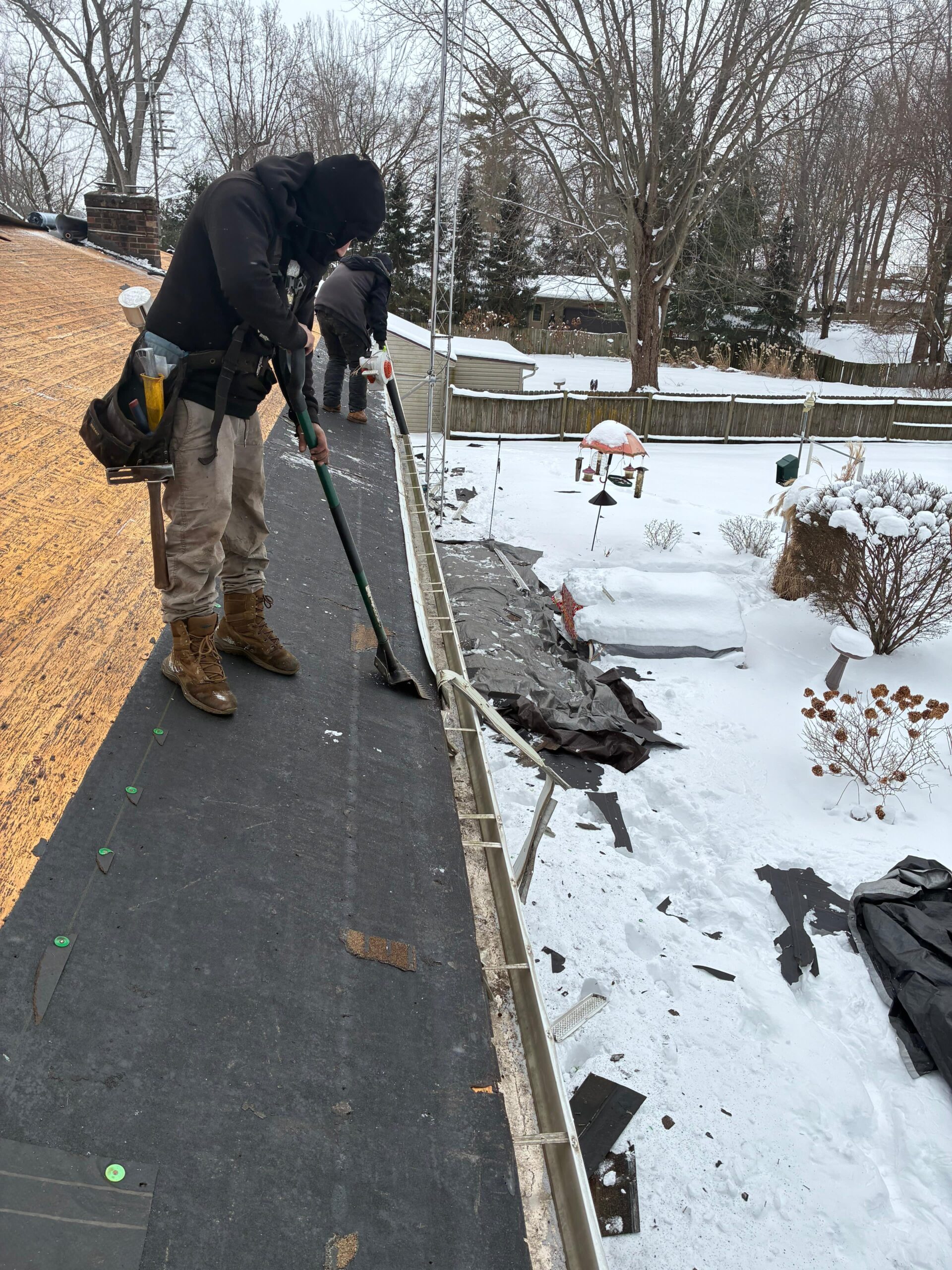 Roofing underlayment installation during asphalt shingle replacement by Lifetime Construction Builders