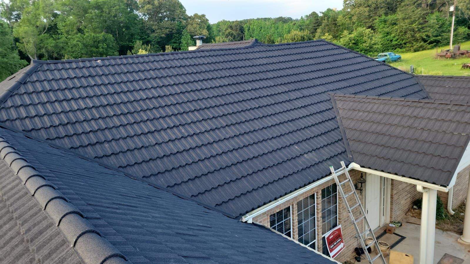 Stone-coated metal tile roof on brick residential home