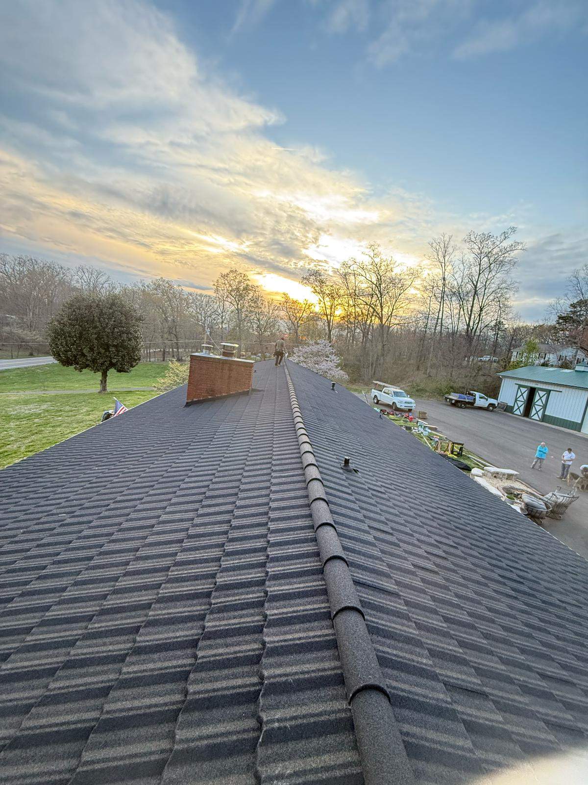 Stone coated steel shingle profile on brick residential home